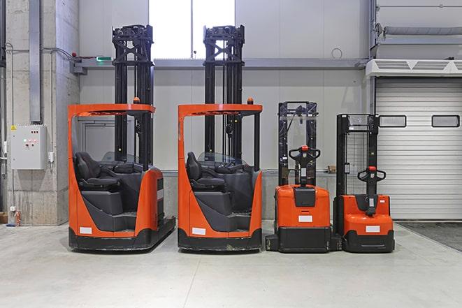 forklifts lifting heavy loads